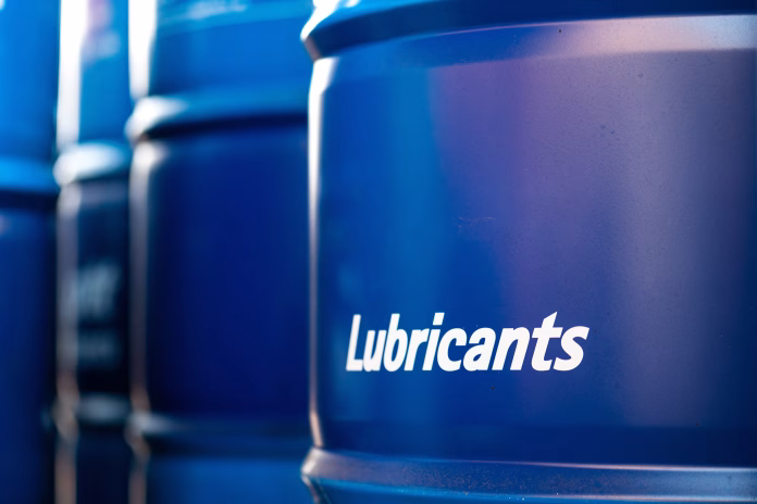 Chemical barrel containment with lubricants oil label on it's metal surface. Industrial object, close-up photo. Automotive lubricants - Find out why Greener Lubricants and Sustainable Parts are essential for automotive businesses aiming for sustainability and cost efficiency